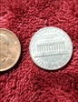 1985 no mint mark  1 Penny shiny silver color completely  MS64